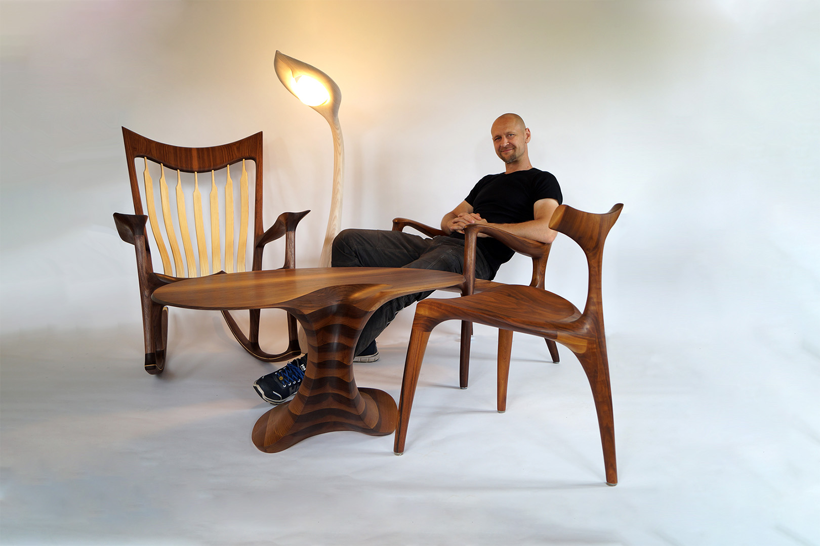 Morten with some of his most popular pieces: the American-inspired Low Rocker, the Low Back Lounge Chair and the Triplex Dining Chair, accompanied by the Sunflower light and his Columnae table.