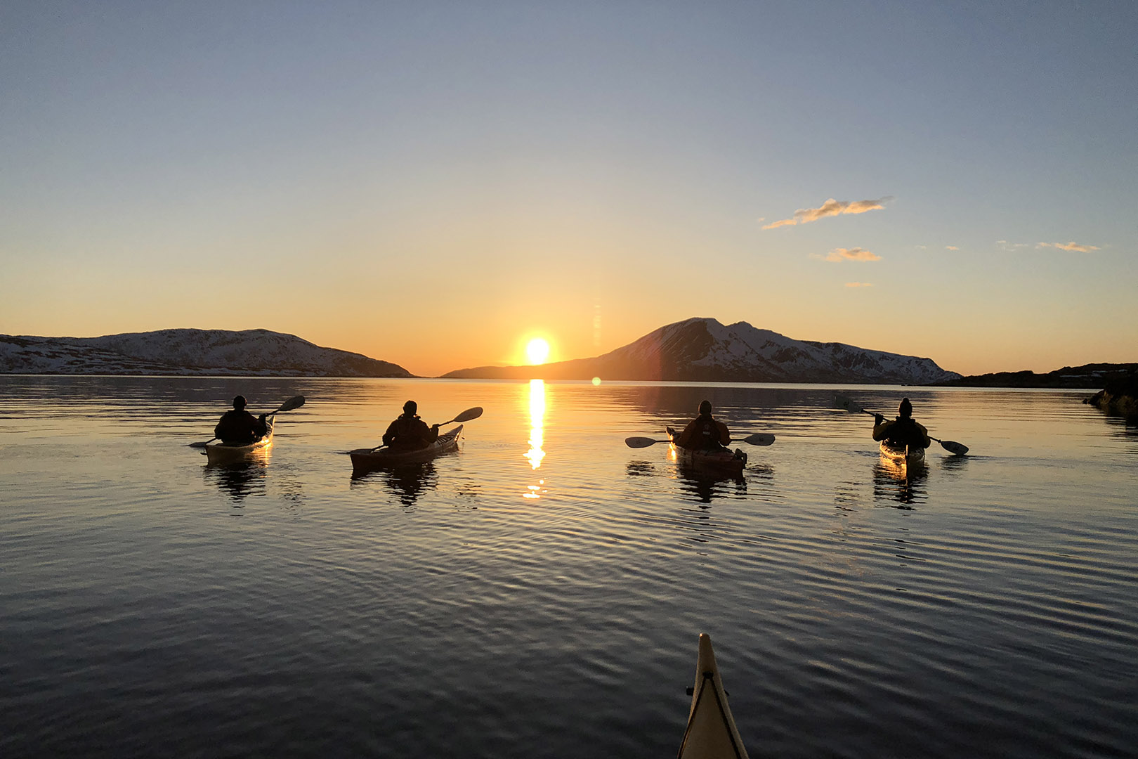 Visit Karlsøy kayaking sunset photoy by Elements Arctic Camp